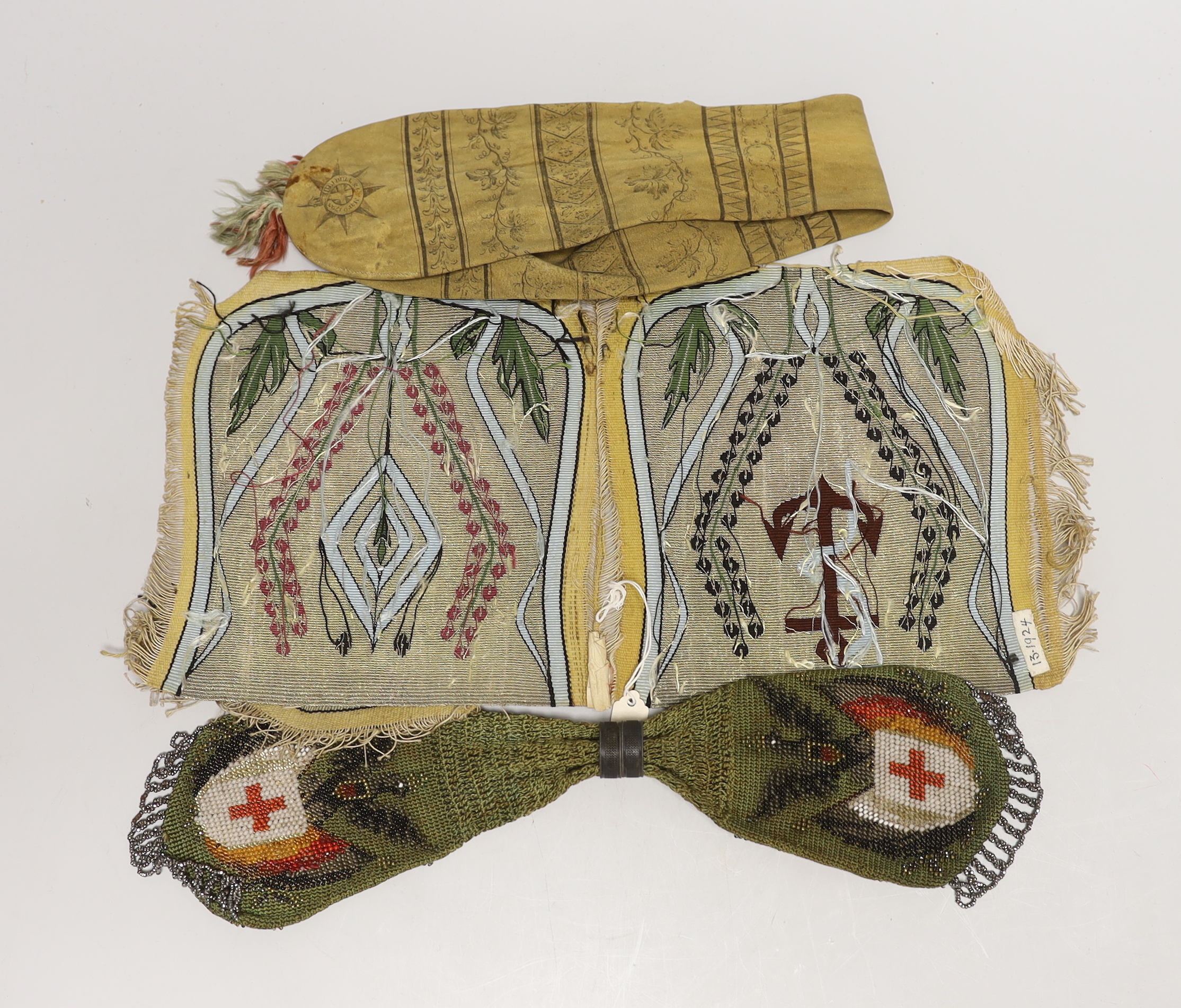 An 18th century American leather misers purse dated 1793, an unused finely woven tapestry, an early 19th century bead worked misers purse, longest misers purse 48cm